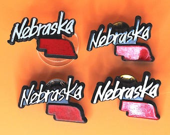 Juego de 4 pines vintage de plástico de Nebraska