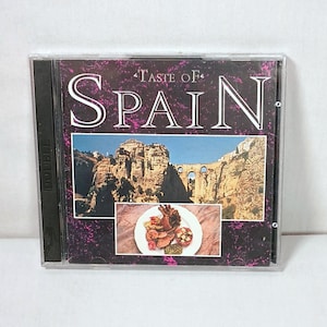 Disco duplo CD de música Taste of Spain inclui livreto com receitas, costumes e história, disco 1 música espanhola autêntica, disco 2 clássico NOVO