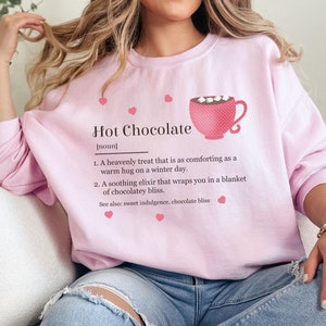 Cozy women's sweatshirt with a cute and whimsical hot chocolate dictionary style definition.