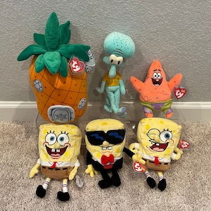 May include: A collection of six plush toys featuring characters and a pineapple house from SpongeBob SquarePants. The set includes a pineapple-shaped house, a light blue Squidward, an orange Patrick, and three variations of SpongeBob SquarePants.