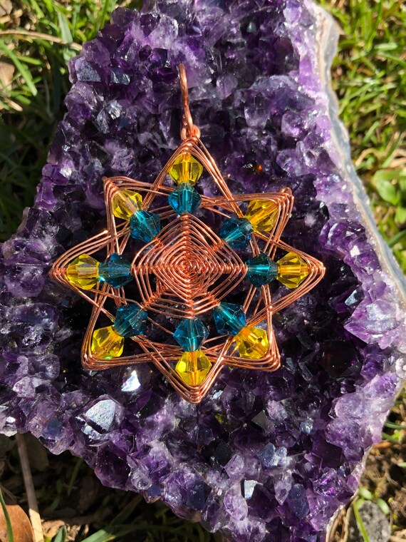 8 pointed star beaded wire wrap pendant wrapped in copper wire with faux leather cord necklace