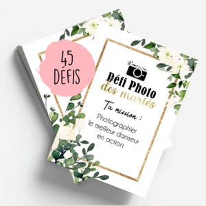 Peut inclure: Une carte blanche avec une bordure dorée et un motif floral. La carte porte le texte "Défi Photo des mariés" et "Ta mission : Photographier le meilleur danseur en action".
