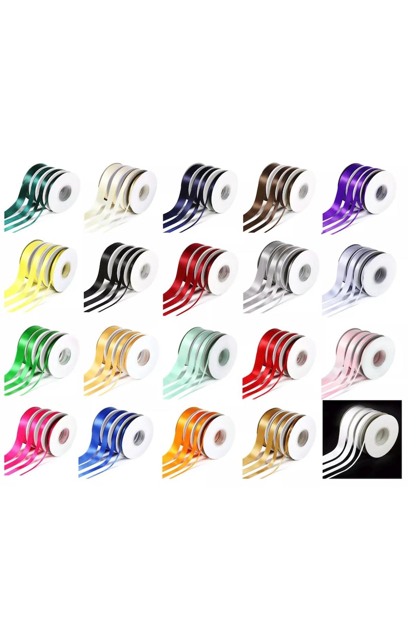 May include: A collection of spools of satin ribbon in various colors, including green, yellow, black, red, silver, and pink. Each spool is neatly rolled, with the ribbon cascading out in graceful curves. Ideal for crafting and gift wrapping.