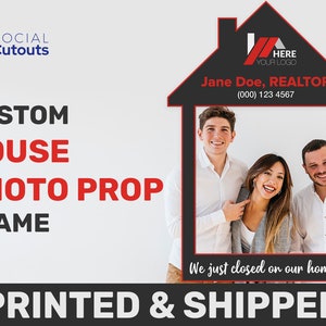 three people taking a photo in their house shaped real estate photo prop