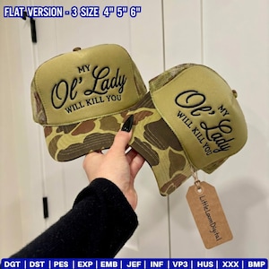 May include: Two trucker hats with a camouflage pattern on the front and a mesh back. The hats have the text "MY Ol' Lady WILL KILL YOU" embroidered on the front. The hats are available in three sizes: 4", 5", and 6".