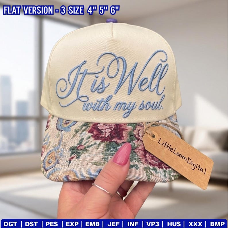 May include: A cream-colored baseball cap with the embroidered phrase "It is Well with my soul" in light blue script. The brim features a floral pattern. A tag reads "Little Loom Digital".