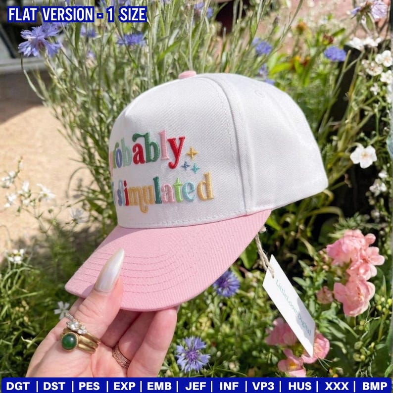 May include: A white baseball cap with a pink brim and top button. The cap features the embroidered text "Probably Simulated" in various colors. The cap is displayed outdoors with flowers in the background.