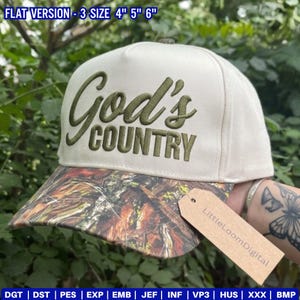 May include: A beige baseball cap with the embroidered text "God's COUNTRY" in olive green. The brim has a camouflage pattern. The tag reads "LittleLoomDigital". The hat is available in 3 sizes: 10 cm, 13 cm, and 15 cm.
