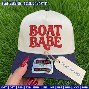 May include: A baseball cap with a cream-colored crown and a navy blue brim. The cap features the embroidered words "BOAT BABE" in red. A tag with the text "LittleLoomDigital" is attached. The hat is available in sizes 5", 6", 7", and 8".