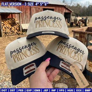 May include: Three beige and navy blue flat-brimmed caps with the text "passenger PRINCESS" embroidered on the front. The caps have a classic fit and are available in sizes 4", 5", and 6". The caps are displayed outdoors.