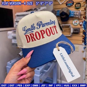 May include: A blue and beige trucker hat with the words "Gentle Parenting DROPOUT" embroidered on the front. The hat has a mesh back and a curved brim. The tag reads "LittleLoomDigital".