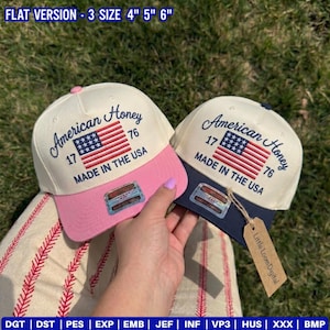 May include: Two baseball caps with the text "American Honey" and an American flag design. One cap has a pink brim, the other a navy blue brim. Both caps have the text "MADE IN THE USA".