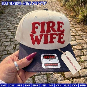 May include: A beige and navy blue baseball cap with the words "FIRE WIFE" in red lettering. The cap has a curved brim and a tag that reads "LittleLoomDigital". The hat is a mid-profile, OSFM (One Size Fits Most) style.
