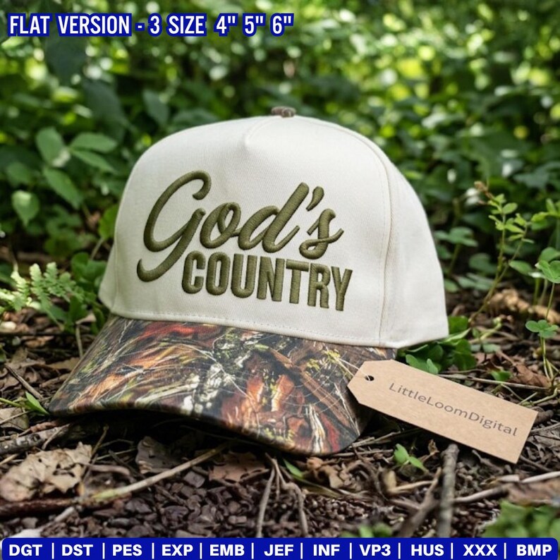 May include: A cream-coloured baseball cap with the embroidered text "God's Country" in olive green. The brim features a camouflage pattern. A tag with "LittleLoomDigital" hangs from the cap. The top of the cap has a small, brown button.