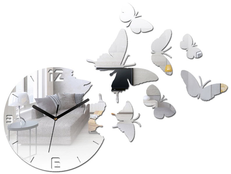 May include: A silver mirrored clock with black hands and Roman numerals. The clock is surrounded by eight silver mirrored butterflies.