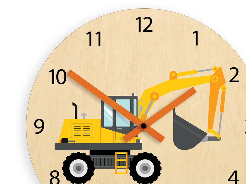 May include: A yellow and black toy excavator with an orange hand on a wooden clock face with black numbers 1 through 12.