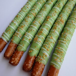 12 Bright Green Chocolate Covered Pretzels with White Chocolate Drizzle and Gold Sprinkles