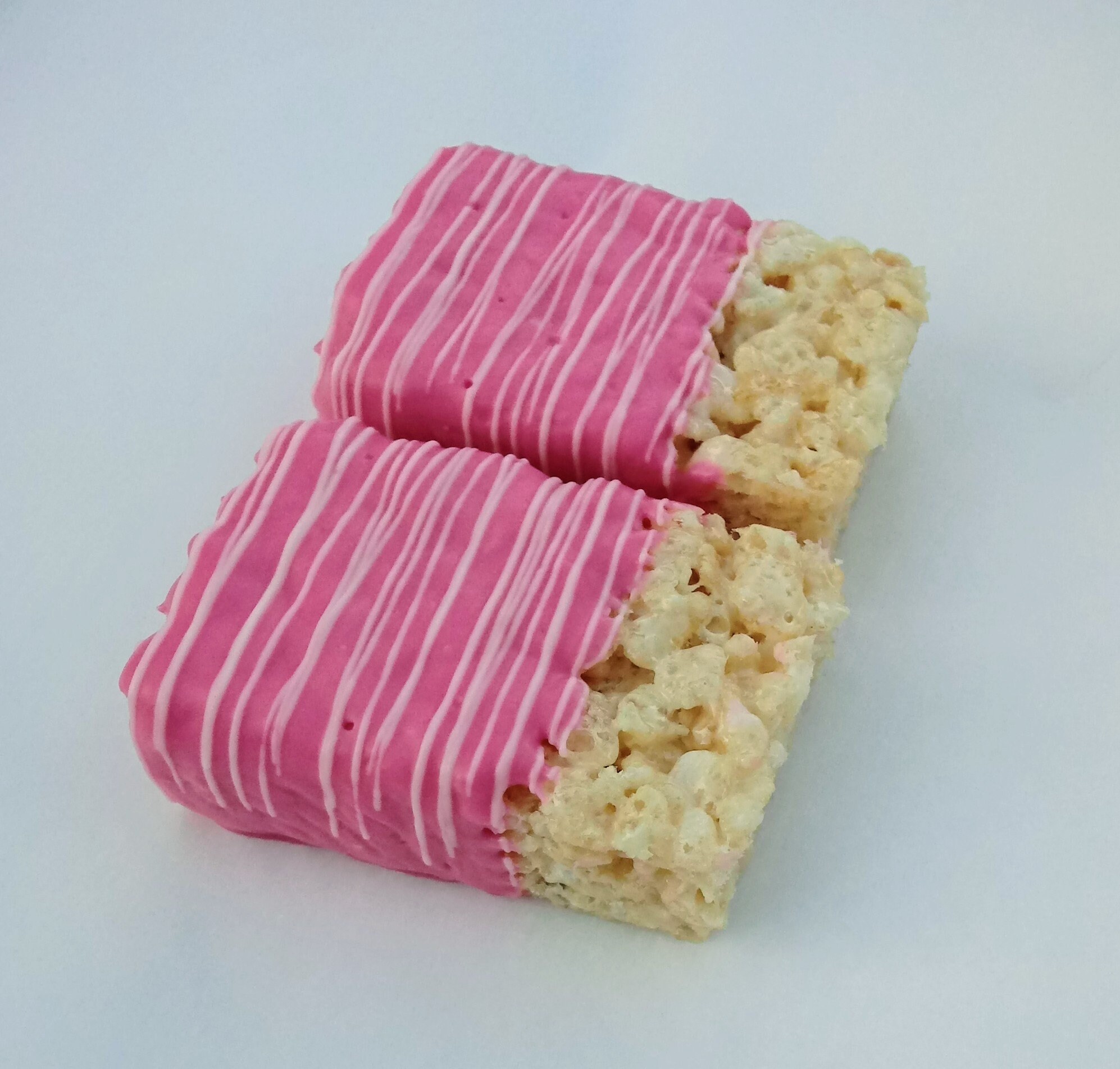 Zebra themed chocolate dipped Rice Krispies Treats with hot pink
