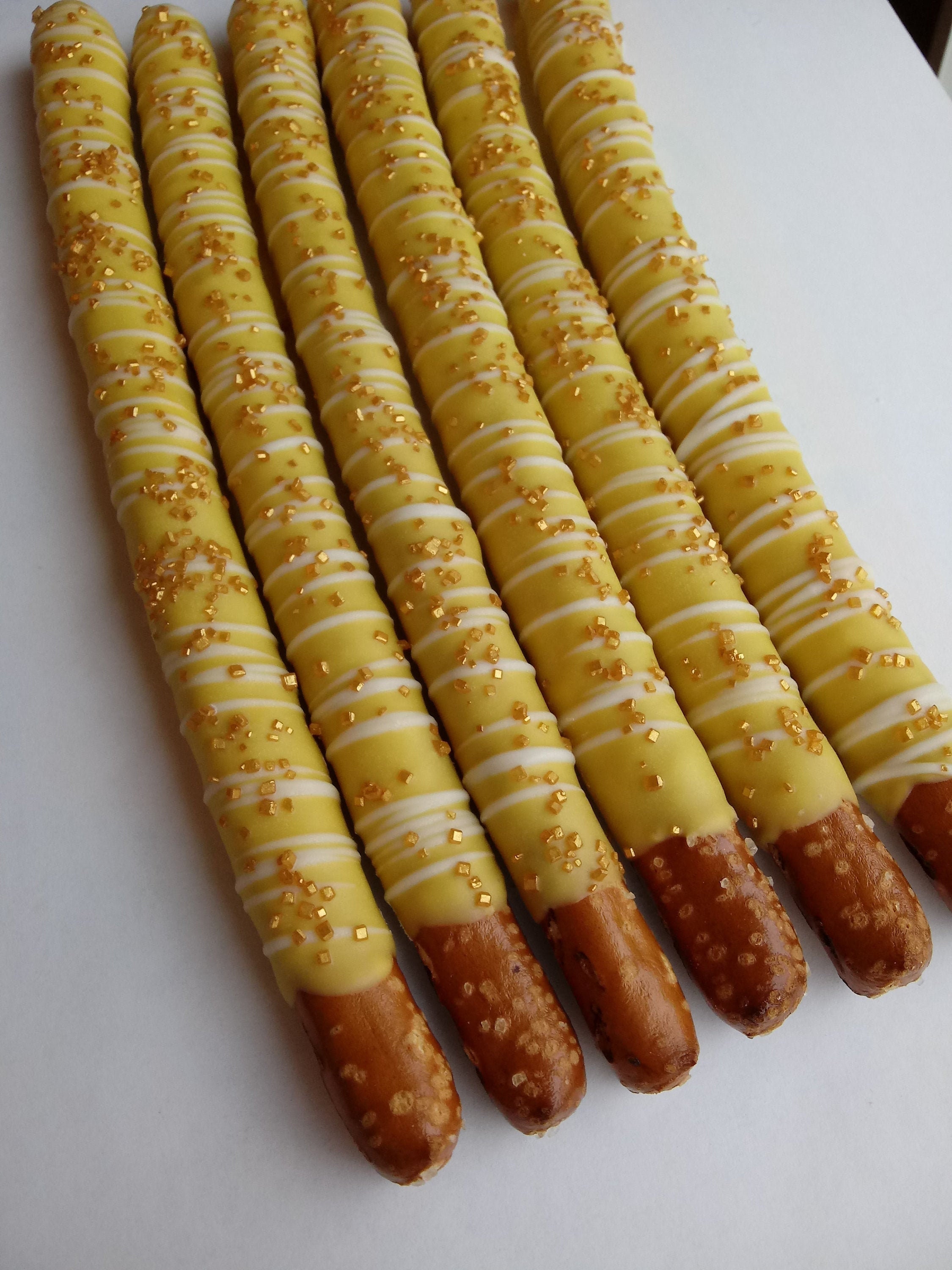 12 Yellow Chocolate Covered Pretzels With White Chocolate