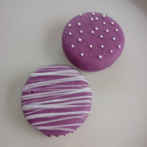 12 Purple Chocolate Covered Oreos with White Chocolate Drizzle and White Dot Sprinkles