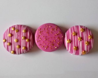 12 Pink Chocolate Covered Oreo Cookies with White Chocolate Drizzle and Gold Sprinkles