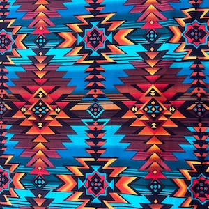 May include: A vibrant fabric featuring a geometric pattern in shades of turquoise, orange, red, and brown. The design includes zigzags, diamonds, and arrow-like shapes, creating a bold, Southwestern-inspired aesthetic.