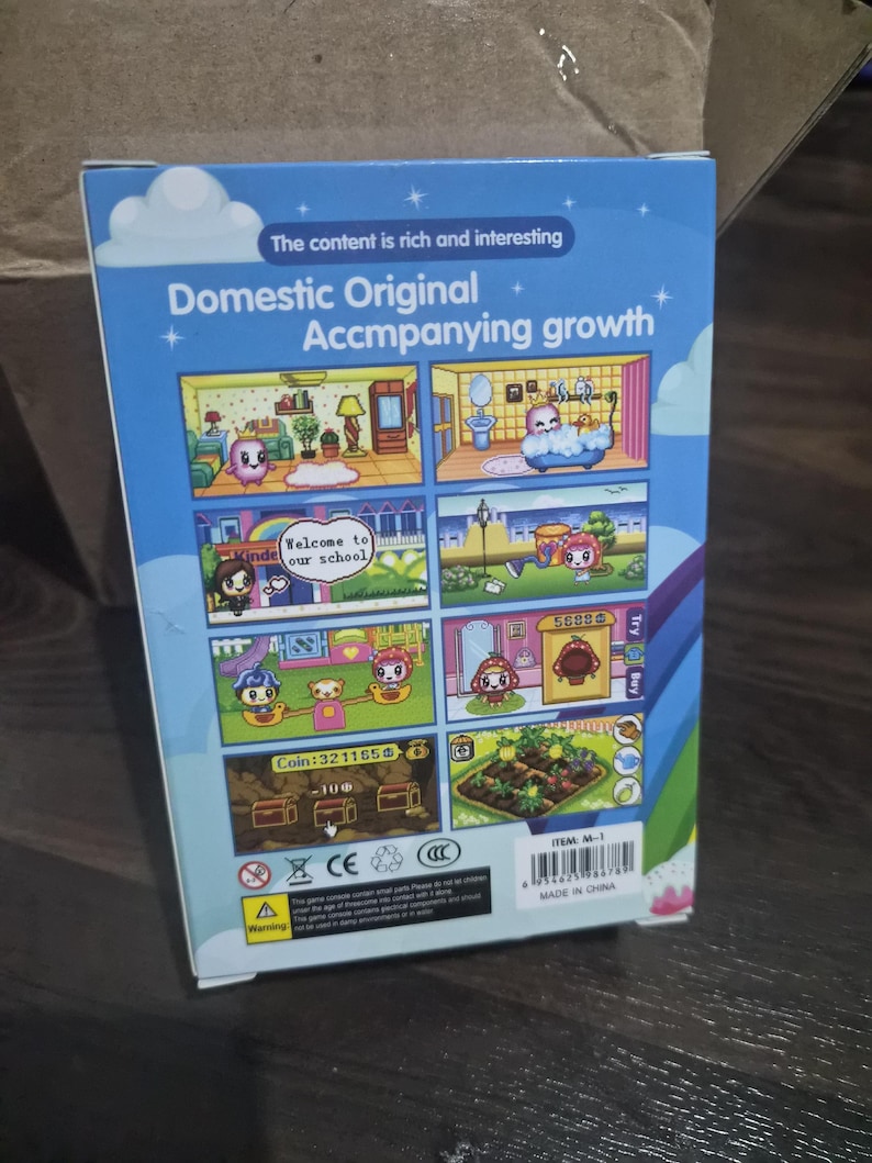 May include: A rectangular blue product box featuring the text Domestic Original Accompanying growth and The content is rich and interesting. The box displays six colorful cartoon game scenes, a barcode, and a warning label on the lower section.