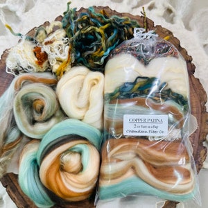 May include: A bag of 2 ounces of Copper Patina fiber batts in a bag from Chameleon Fiber Co. The batts are a mix of white, brown, teal, and green colors.