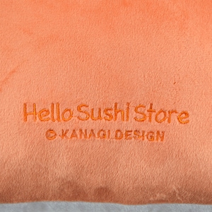 May include: Orange fabric with the text "Hello Sushi Store" and "&copy; KANAGI DESIGN" embroidered in orange thread.