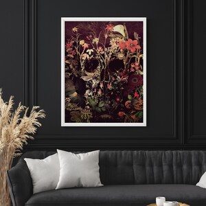 May include: A skull made of flowers with a dark background. The skull is made of various flowers in shades of red, pink, white, and green.