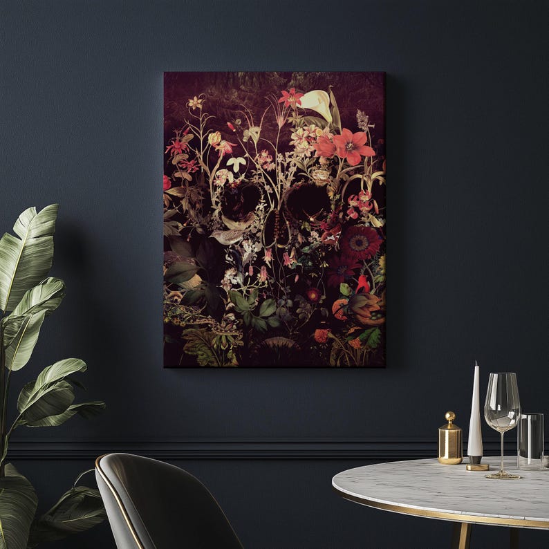 May include: A dark, moody floral skull art print with a skull shape formed by a variety of flowers and leaves in shades of red, pink, and green.
