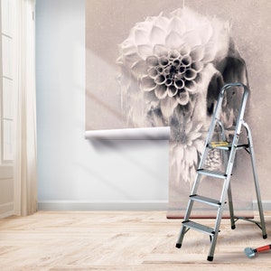 May include: A floral wallpaper with a skull design is partially installed on a wall. A silver step ladder and tools are in the room. The room has a light wood floor and a window with a white curtain.