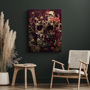 May include: A dark, abstract floral skull art print with a dark background and vibrant red, pink, and yellow flowers. The skull is made up of the flowers and leaves.