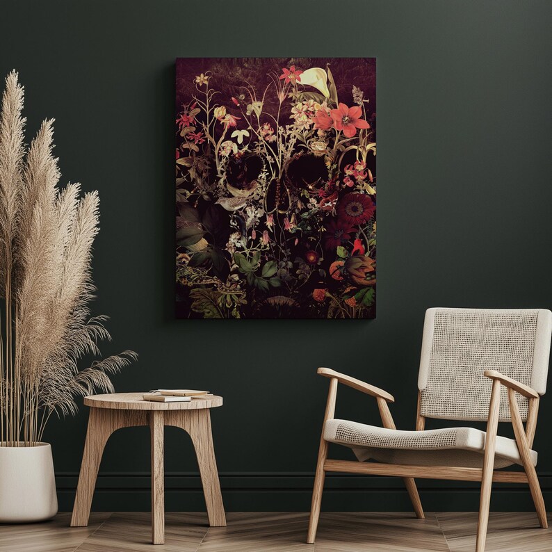 May include: A dark, abstract floral skull art print with a dark background and vibrant red, pink, and yellow flowers. The skull is made up of the flowers and leaves.