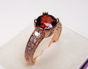 Spessartite Garnet Ring. Stunning 14kt. Rose Gold, 2.0 Carat 7mm. Round Spessartite with Quality Diamond Accents.