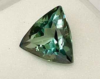 Green Topaz Gem.  Genuine, blue green Topaz measuring 12mm x 12mm Trillion.  6.40ct..  Great saturation.  Best set as a ring or pendant.