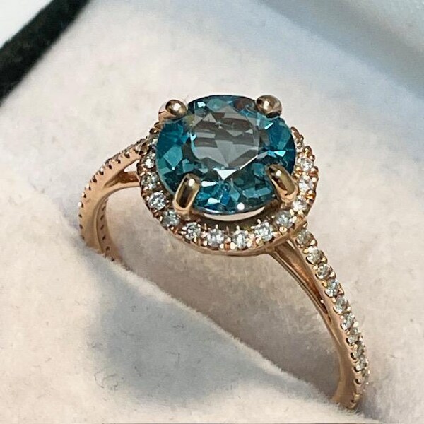 14kt. Gold, Zircon Ring. 7mm. Cambodian Zircon set in a 14kt. Rose Gold Ring with Diamond Accents.