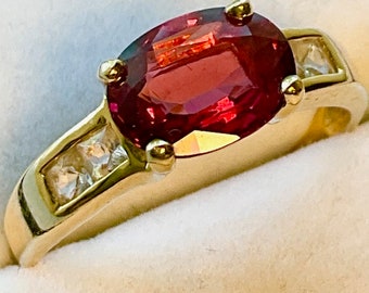 Ruby Ring. Genuine, Pinkish Red, 3.5ct., Ruby Ring with Diamond accents set in 14kt yellow Gold.