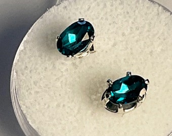 London blue Topaz  earrings.  Genuine, 6mm x 4mm earrings set in Sterling Siver.