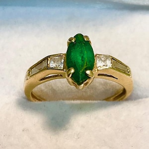 Chrome Diopside ring.  Beautiful marquise cut Chrome Diopside with Diamond accents set in 14kt. yellow gold.