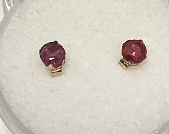 Ruby earrings set in 10kt yellow gold.  Genuine, 3mm Rubies set in 14 Karat gold