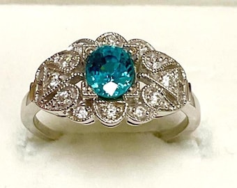 14kt. Gold, Natural Zircon Ring. 1.08ct. Cool Water Blue Cambodian Zircon 5 x 5.5mm. Roval with Diamond Accents. Only One Made