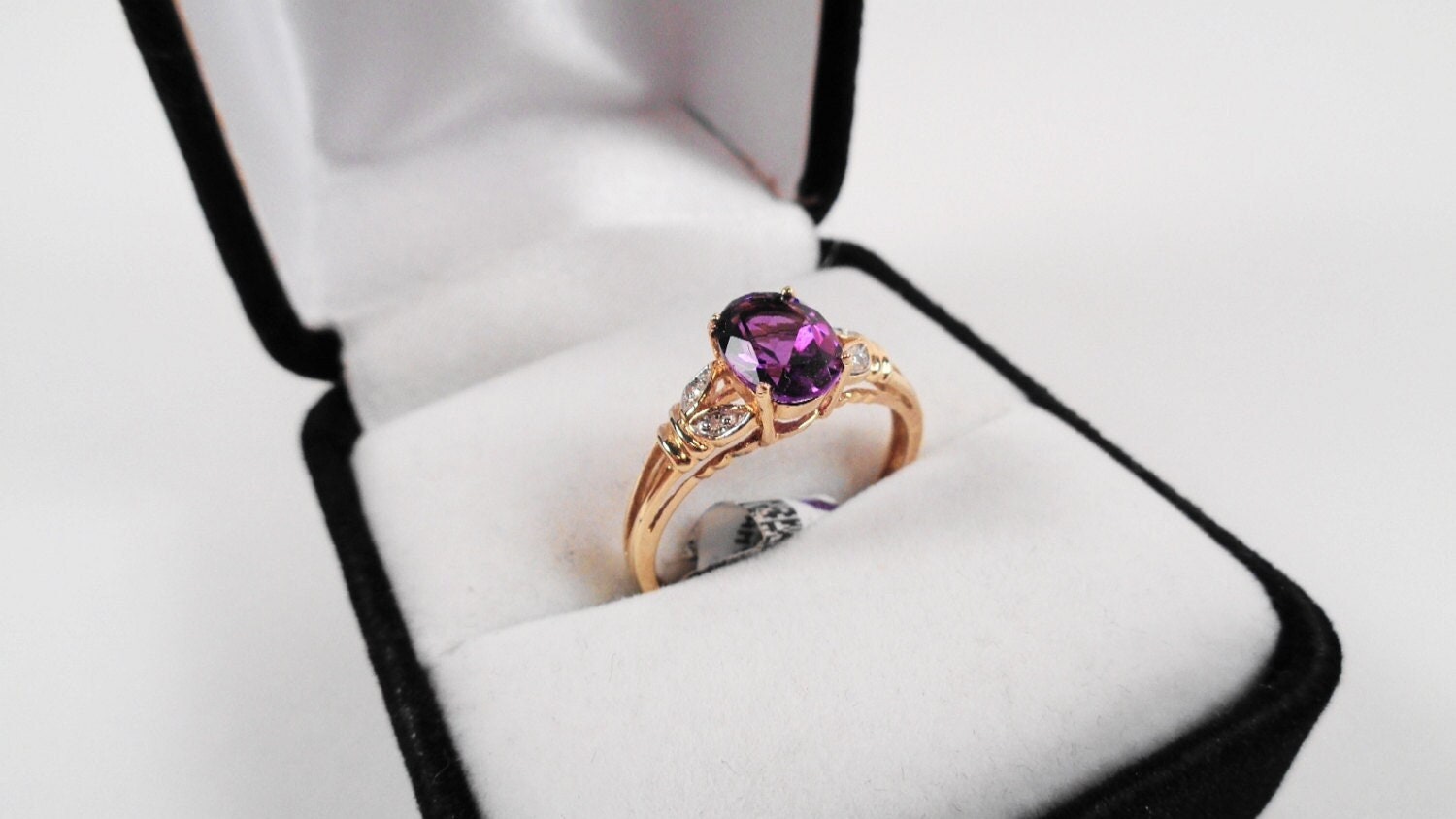 1.16ct. Amethyst 8 x 6mm. Oval in a 10kt. Yellow Gold Ring with Diamonds