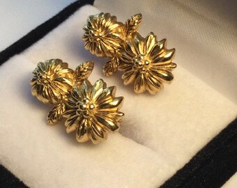 Floral gold tone earrings.