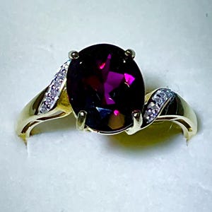 14kt. Gold, Rhodolite Garnet Ring. A 4.6 Carat Rhodolite Garnet set in a 14kt. Ring with Diamond Accents. One of a Kind!