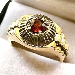 Men&#39;s Spessartite Garnet ring.  Beautiful 5mm. Spessartite Garnet set in a 14kt. yellow gold ring.  Over 11.5 grams of gold.  Vintage.