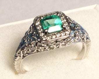 14kt. Gold, Emerald Ring. Natural .60 ct. Emerald in a 14kt. White Gold Ring with Diamonds.