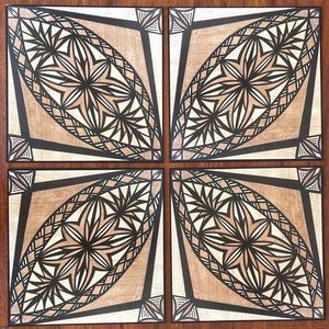 May include: Four square wooden tiles with a geometric pattern in black and white. The tiles are arranged in a square, with each tile featuring a different orientation of the pattern.