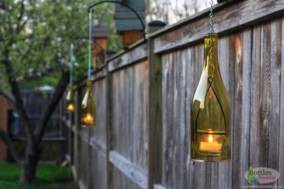 Wine bottle tea light holder outlet