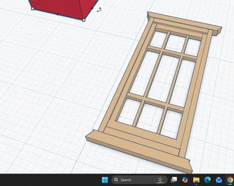 May include: A digital 3D model of a rectangular wooden window frame with a grid of muntins creating multiple panes. The frame is light brown and set against a white grid background, with a red geometric shape visible in the upper left corner.